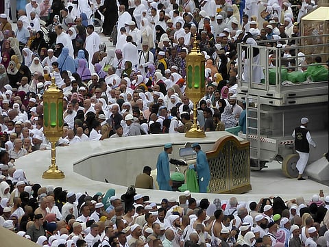 Workers clean the Kaaba as Muslim pilgrims circumambulate around it at the Grand Mosque, during the minor pilgrimage, known as Umrah in the Muslim holy city of Mecca, Saudi Arabia. (Photo | AP)