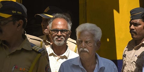 P Varavara Rao and Sudhir Dhawale, who are accused in the Elgar Parishad case, are escorted by police to court. (Photo| PTI)