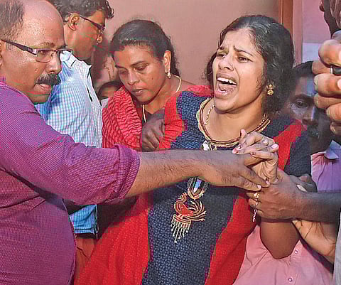 Dhanya, Devanandha’s mother, breaks down upon seeing her child’s body at Elavoor in Pallimon on Friday | B P Deepu