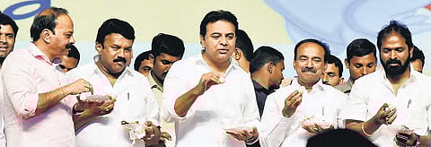 Industries and IT Minister KT Rama Rao, along with other ministers and officials enjoys some boiled eggs at the ‘Chicken and Egg Mela’ at People’s Plaza in Hyderabad on Friday. (Photo| EPS/S Senbagapandiyan)