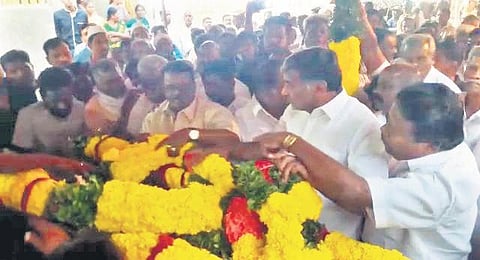 Minister for Commercial Taxes and Registration KC Veeramani paying homage in Pernambut | Express