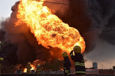 Smoke rising from the building following the fire ( Photo |EPS/ R Sathish Babu)