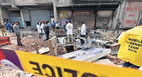 Forensic experts collect samples from a riot-hit site in New Delhi. (Photo | Shekhar Yadav, EPS)