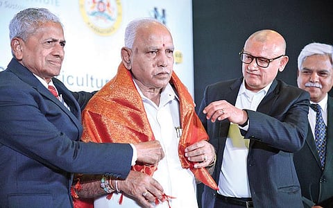 Chief minister B S Yediyurappa being felicitated at a conference on Approaches to shaping Climate Resilient Agriculture in Bengaluru on Friday | nagaraja Gadekal