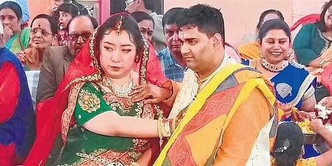 Xi Jao ‘Dora’ and Satyarth Mishra during their marriage ceremony at Mandsaur on Sunday. (Photo | EPS)
