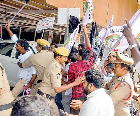 Police arrest activists of Visalandra Mahasabha as they tried to barge into Income Tax Office demanding special category status. (File Photo | EPS)