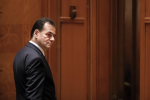 Romanian Prime Minister Ludovic Orban leaves after losing a no-confidence vote in parliament in Bucharest, Romania. (Photo | AP)