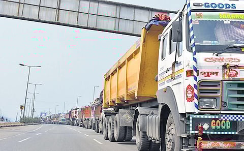 Vehicles stranded on National Highway 53 and shops closed during the dawn-to-dusk bandh in Sambalpur town. (Photo | EPS)