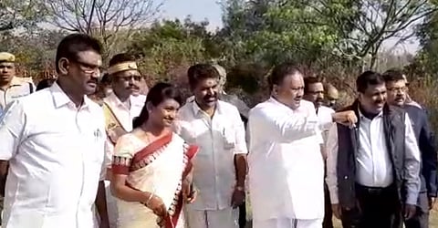 Tamil Nadu State Minister for Forests Dindigul C Sreenivasan calling tribal children during inauguration of the camp at Mudumalai Tiger Reserve. (Photo | Screengrab)