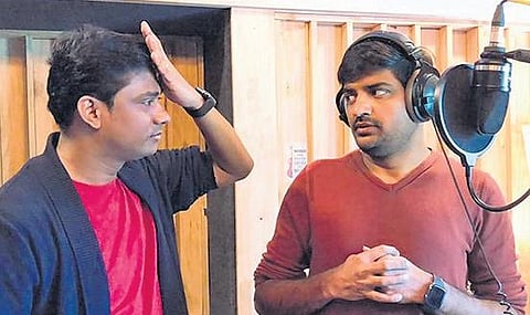 Music director Sam CS with Sathish.