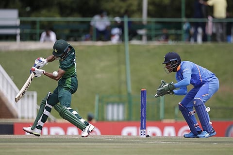 Pakistan's Fahad Munir (L) plays a shot as India's Dhruv Jurel (R) looks on during the Semi-Final of the ICC Under-19 Cricket World Cup. (Photo | AFP)