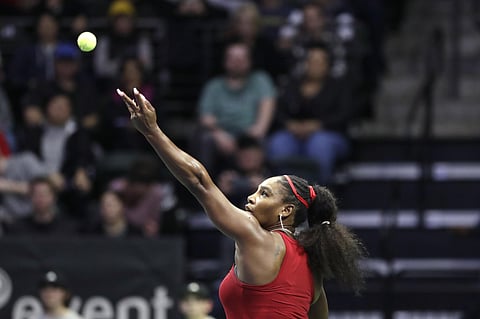 United States' Serena Williams tosses the ball for a serve to Latvia's Jelena Ostapenko during a Fed Cup qualifying match. (Photo | AP)