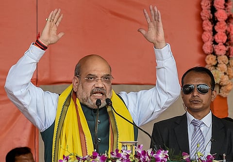 Union Home Minister Amit Shah addresses during a rally at Shaheed Minar Ground in Kolkata Sunday. (Photo | PTI)