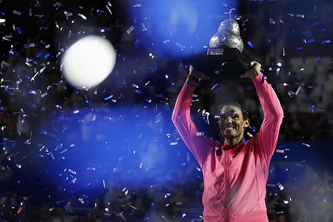 Rafael Nadal lifts his trophy after defeating Taylor Fritz in the men's final of the Mexican Open tennis tournament in Acapulco. (Photo | AP)