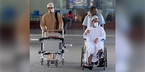 Passengers wearing masks at the Chennai airport on Monday. (Photo | Martin Louis, EPS)