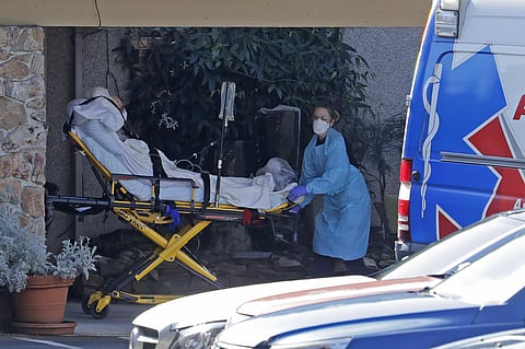 A patient is loaded into an ambulance at the Life Care Center in Kirkland, Wash. Monday, March 9, 2020, near Seattle. (Photo | AP)