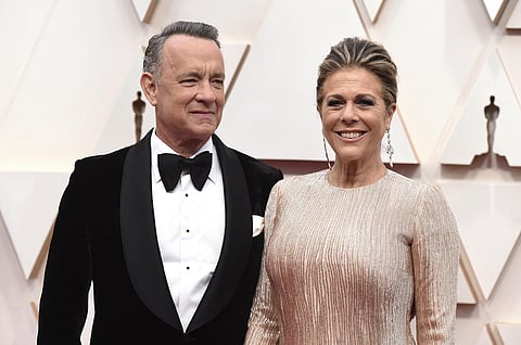 Tom Hanks, left, and Rita Wilson arrive at the Oscars at the Dolby Theatre in Los Angeles. The couple have tested positive for the coronavirus, the actor said in a statement Wednesday, March 11. (Photo | AP)