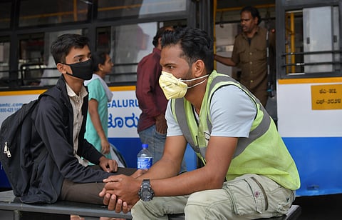 Due to Coronavirus scare and positive cases on the rise, Bengaluru is gripped by panic. Citizens seen in masks at the Shivajinagar busstand. (Photo | Meghana Sastry, EPS)