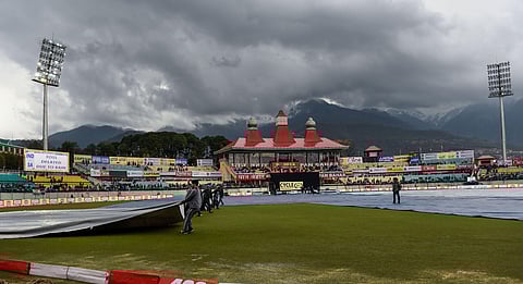 The HPCA Stadium ground is covered due to rains in Dharamshala Thursday March 12 2020. (Photo | PTI)