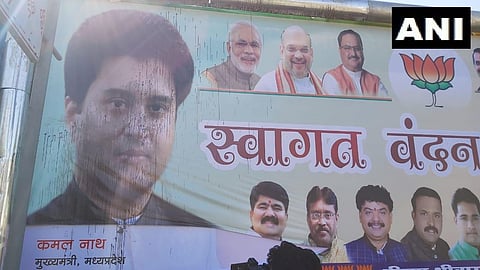 The poster featuring Jyotiraditya Scindia had ink thrown on it. (Photo| ANI)