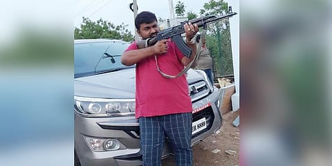 'The police personnel on duty removed the bullets in the gun and let me pose with it,' the man said.