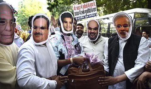 Activists of Youth Congress during a symbolic protest on against horse trading of Congress MLAs and leaders resorted to by BJP near Parliament house in new Delhi on Wednesday. (Photo | Parveen Negi/EPS)