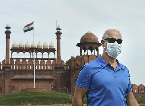 A visitor wears a mask to mitigate the spread of coronavirus, at Red Fort in New Delhi. (Photo | PTI)