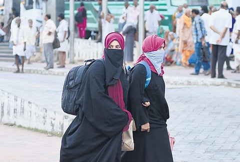 In the wake of the COVID-19 scare, people are increasingly covering their faces in public. A scene from Thampanoor bus terminal in Thiruvananthapuram | B P Deepu