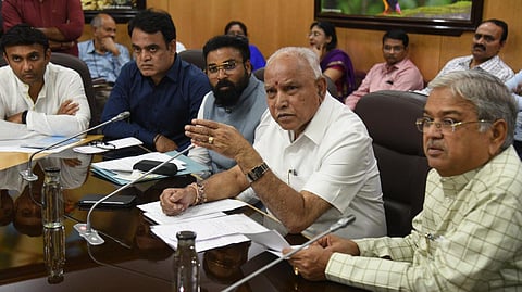 Karnataka CM Yediyurappa chairs a high-level meeting on coronavirus with ministers and officials at Vidhan Soudha in Bengaluru on Friday. (Photo | EPS/Nagaraja Gadekal)