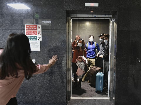 Evacuees leave after they were tested negative for the novel coronavirus COVID-19 at the ITBP facility in Chhawla Friday. (Photo | PTI)