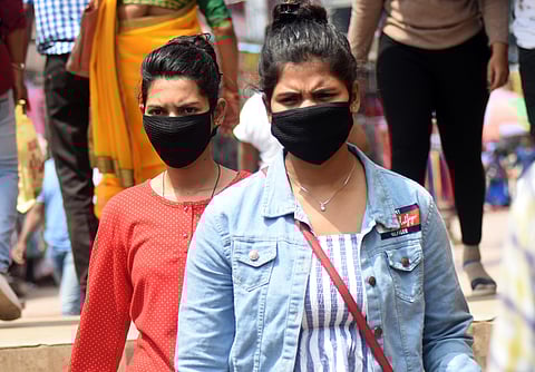 Commuters wearing face masks to guard against Coronavirus. (Photo | Biswanath Swain/EPS)