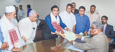 Journalist Ajit Kumar Bhuyan, the consensus pick of Congress and AIUDF, files his nomination in Guwahati. (Photo | PTI)