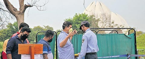 Visitors to the Lotus Temple being screened in New Delhi on Saturday. (Photo | EPS/ASHISH KUMAR KATARIA)