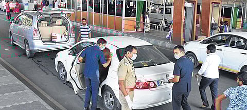 Wearing masks, security gurads screening pilgrims at the Alipiri checkpost in Tirupati. (Photo | Madhav K, EPS)
