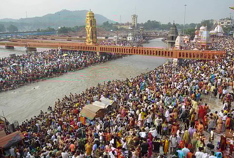 People gather on the banks of river Ganga to pay obeisance in Haridwar. (File photo| PTI)