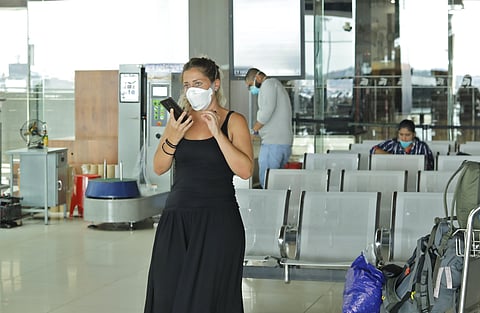 People waiting for check-in process at the deserted Cochin International Airport. (Photo | Arun Angela/EPS)
