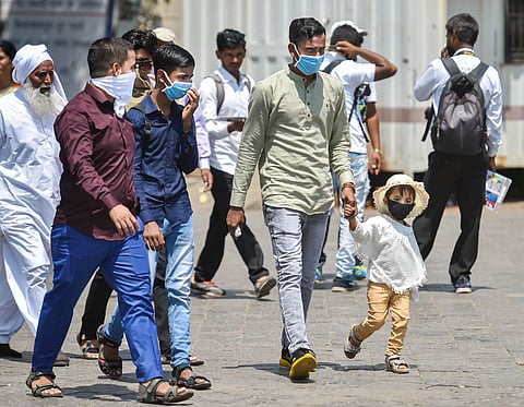 People wear protective masks in view of coronavirus pandemic at Gateway of India in Mumbai Sunday March 15 2020. (Photo | PTI)