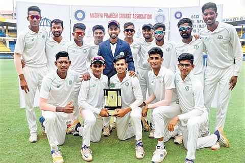 The Tamil Nadu team with the trophy.