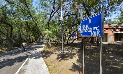 The newly-erected signboard named after V D Savarkar is defaced with ink at JNU campus in New Delhi Tuesday March 17 2020. (Photo | PTI)