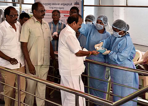 Tamil Nadu Minister Kadambur Raju disinfecting his hands while entering at Assembly on Wednesday in Chennai. (Photo | P Jawahar/EPS)