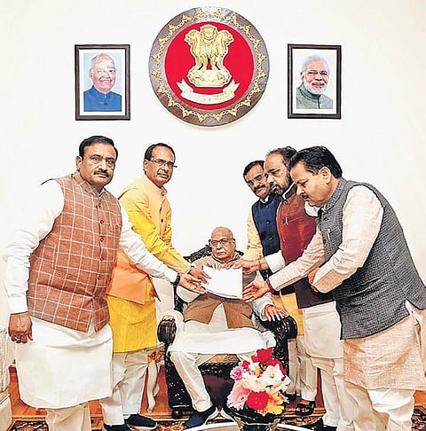 BJP vice-president Shivraj Singh Chouhan (second from left), along with party leaders, submits a memorandum to Governor Lalji Tandon in Bhopal on Tuesday. | pTI
