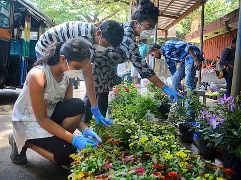 A family wearing hand gloves and masks due to coronavirus pandemic. (Photo| EPS/ Manu R Mavelil)