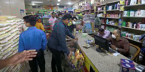 People wearing protective masks shop at Kendriya Bhandar in the wake of coronavirus pandemic in New Delhi. (Photo| Shekhar Yadav, EPS)