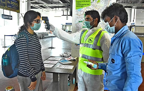 A passenger udergoing thermal scanning at Chennai Airport Metro station. (Photo | Ashwin Prasath, EPS)