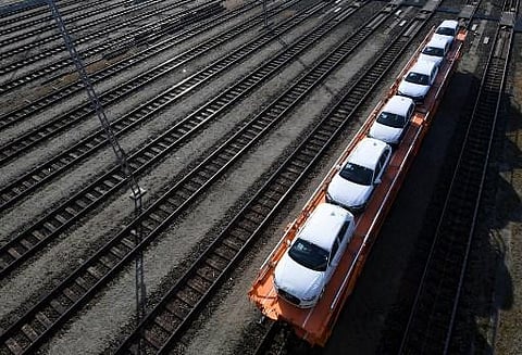 Loaded vehicles from German car manufacturer Volkswagen are transported by train at the freight station in Munich. (Photo | AFP)