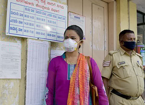 Staff and general public seen in masks at the KSRTC Bus Depot in Bengaluru on Friday. (Photo | Meghana Sastry/EPS)