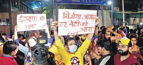 People hold placards outside Tihar Jail after execution of four convicted men in Nirbhaya case in New DelhI. (Photo | AniL Shakya )