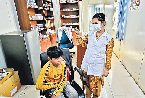 A boy being tested by a nurse at a Mohalla clinic on Saturday (Photo | PTI)
