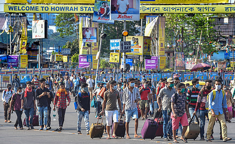 Passengers arrive at Howrah station looking for transport to reach their destination during 'Janata curfew' in the wake of coronavirus pandemic in Kolkata Sunday March 22 2020. (Photo | PTI)