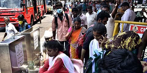 Passengers wash their hands at Chennai's CMBT bus terminal on Monday. (Photo | P Jawahar, EPS)